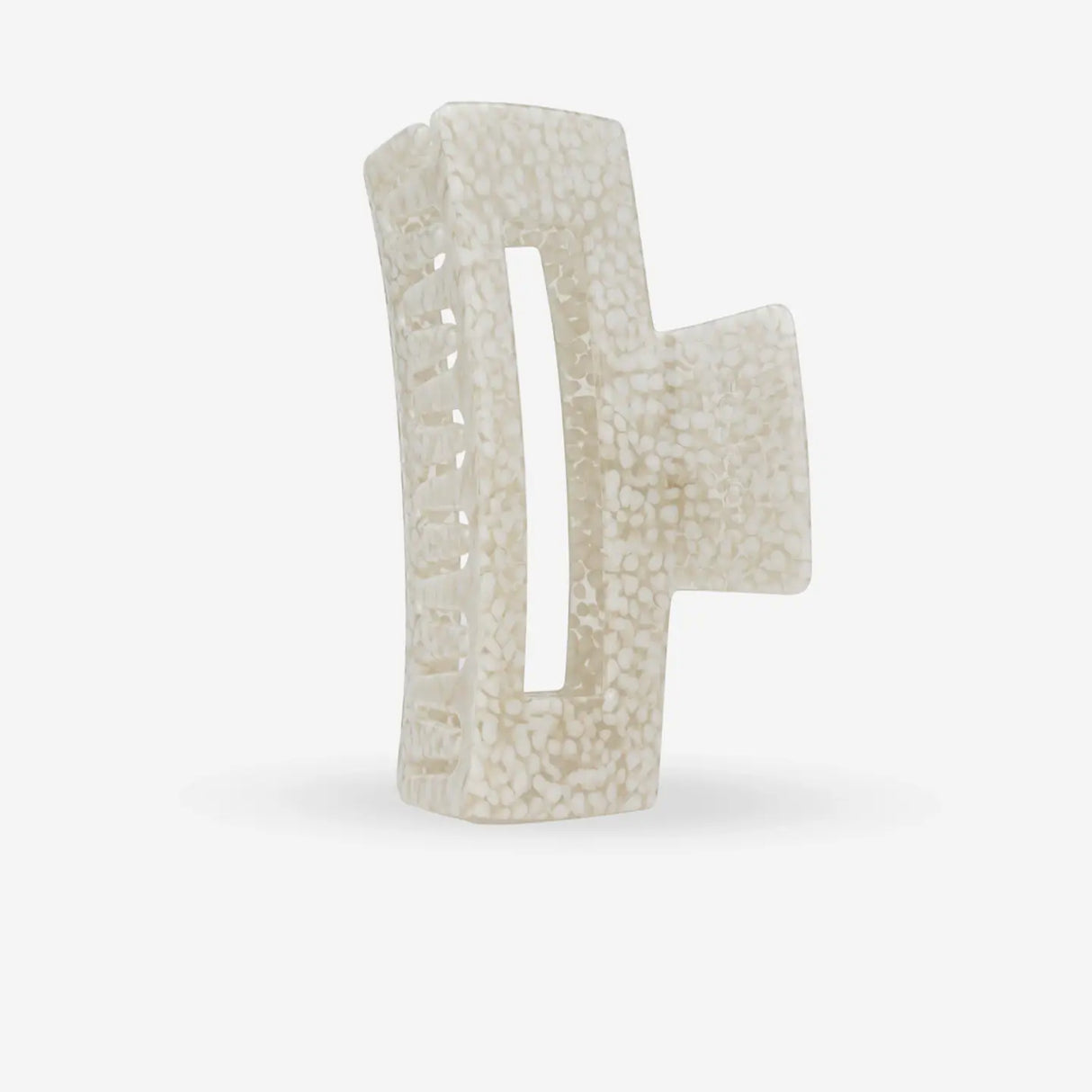 White textured hair clip on a white background