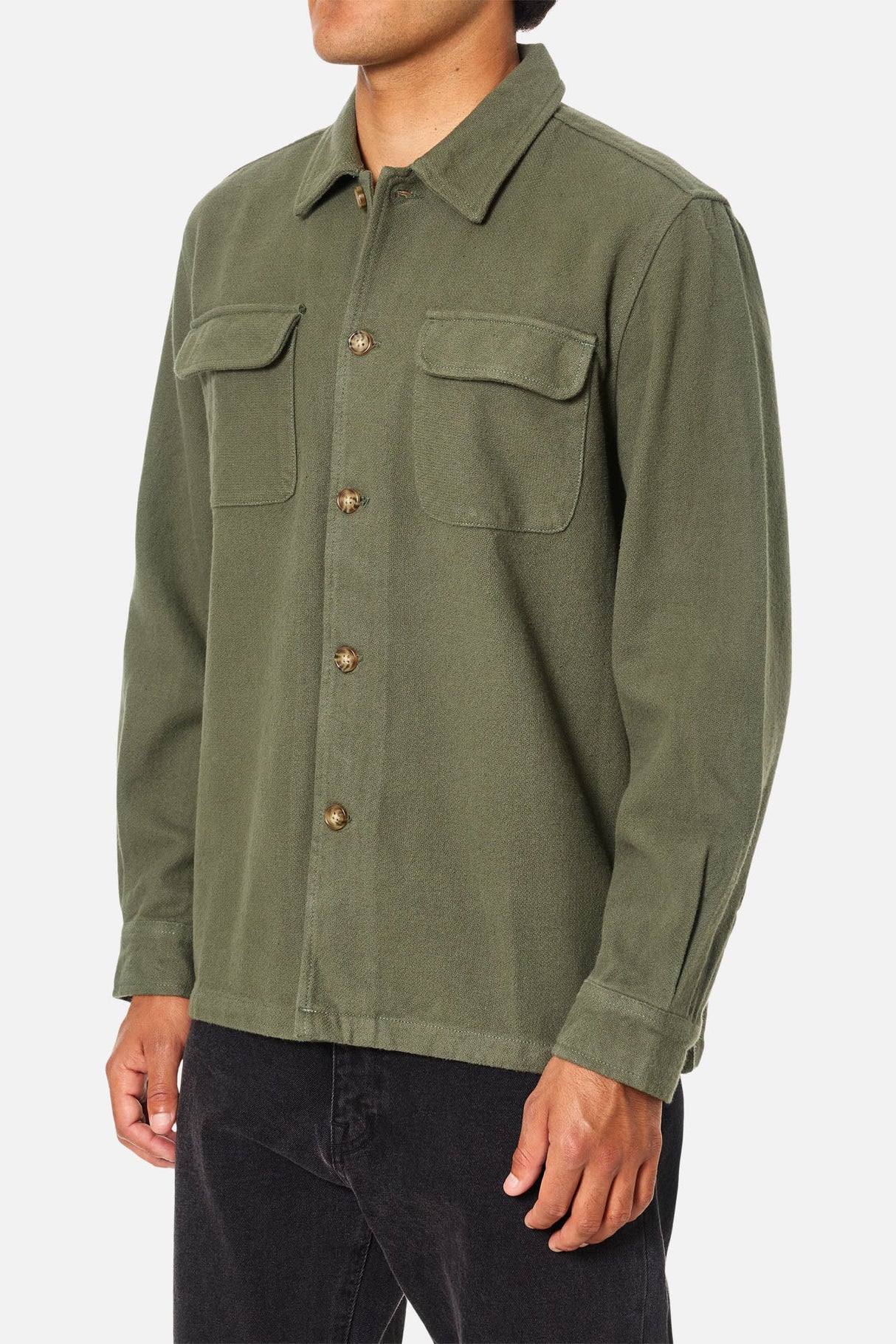 a man wearing a katin shiloh flannel shirt in thyme