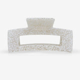 Rectangular hair clip with textured surface on a white background