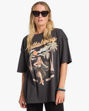 Person wearing a black billabong t-shirt with a graphic design on a white background