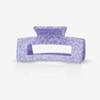 A sasstie recycled plastic purple hair clip on a white background
