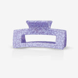 A sasstie recycled plastic purple hair clip on a white background

