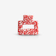Recycled plastic sasstie hair clip in red on white background