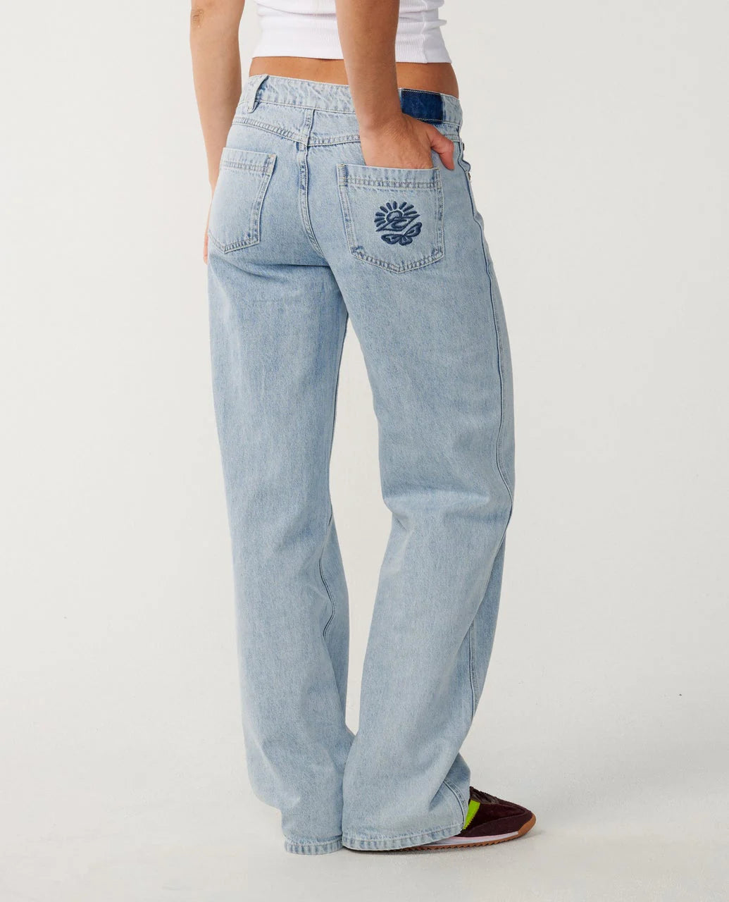 Rip Curl Light blue aggie jeans worn by a person on a white background