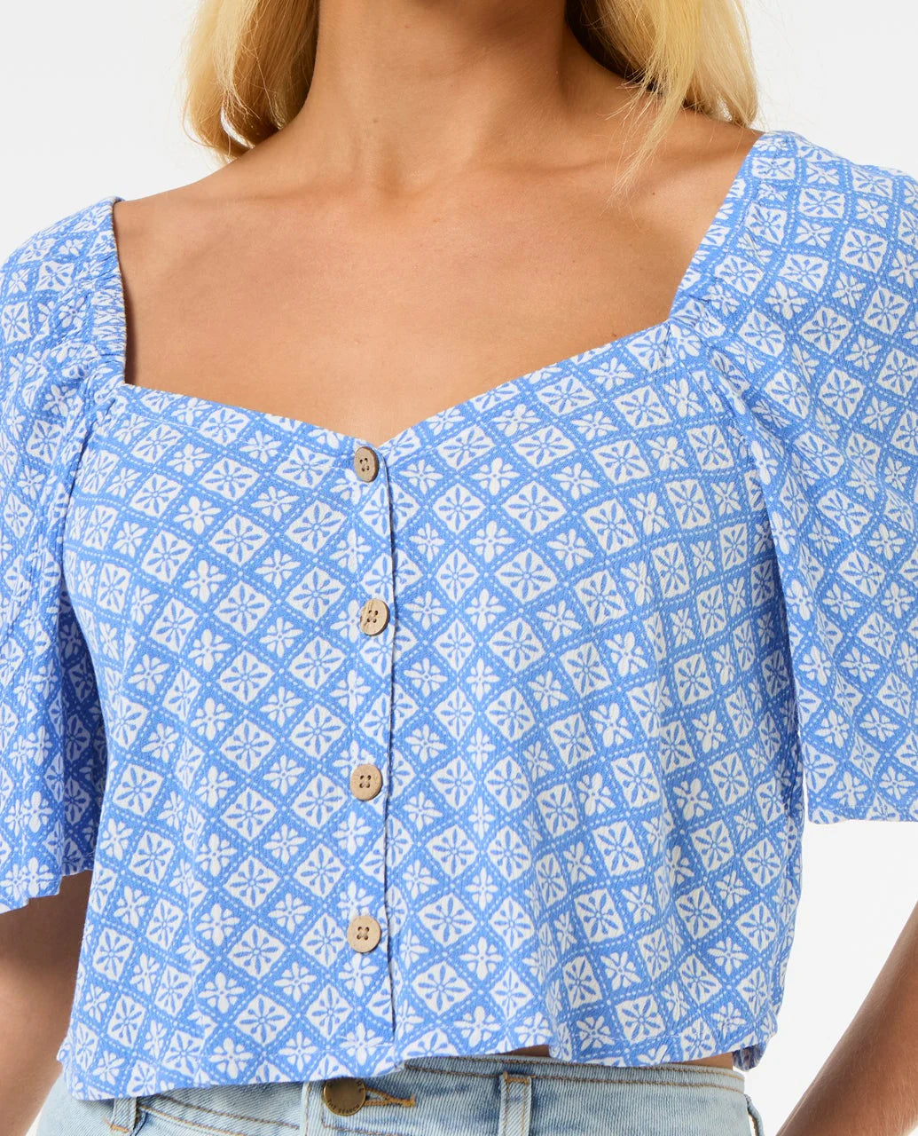 Blue rip curl san carlos patterned blouse with buttons on a white background