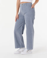 a woman wearing the rip curl stevie cord trousers