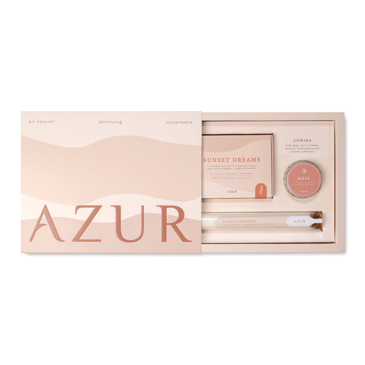 AZUR skincare product set with a pink and beige color scheme on a white background, set includes bath salts, natural body soap and lip balm