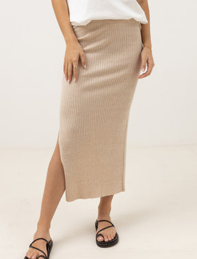 woman wearing rhythm hayman knit midi skirt against a white background