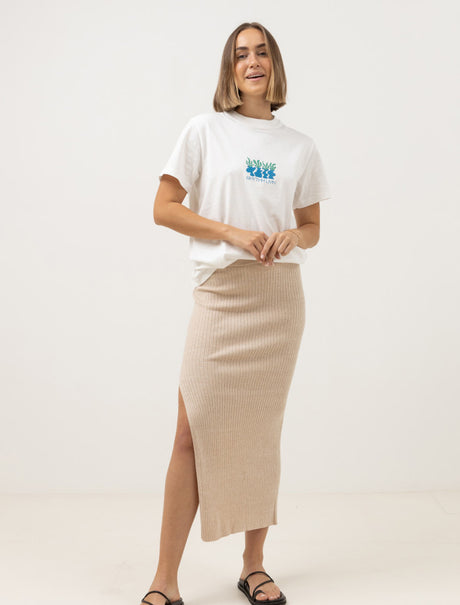 woman wearing rhythm t-shirt and hayman knit midi skirt against a white background