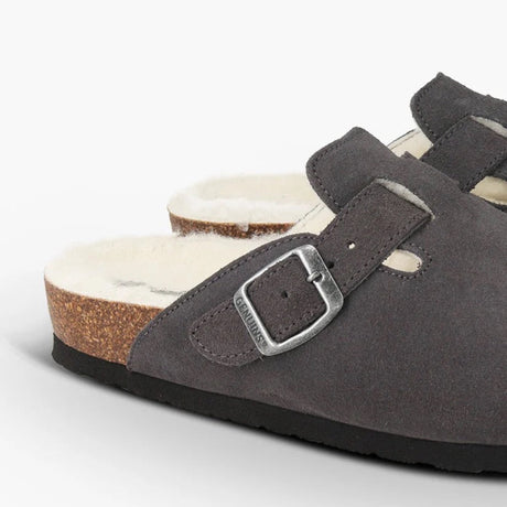 Gray suede sandal with a buckle on a white background